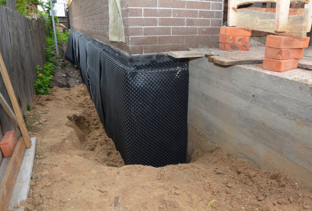 SJ Waterproofing Pros technician performing targeted Sump Pump Installation assessment in Hanover, MN